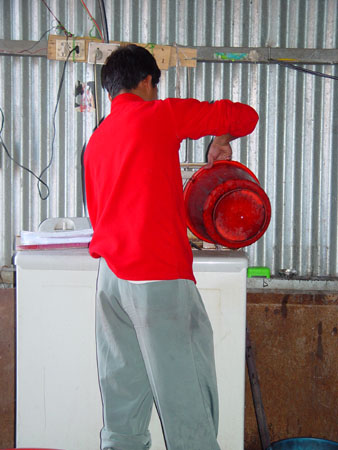 Suman draining and rinsing the wrap