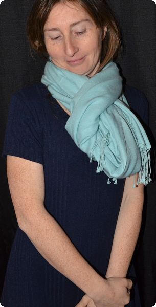 Empar is wearing a fullsize Ama Dablam shawl in Pastel Turquoise  (#ADft-071LL)