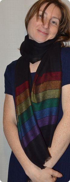 Empar is wearing our Diversity Pride shawl, black with rainbow stripes at the narrow edges. 100% pashmina!