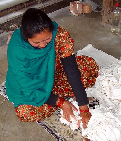 Thuli masaging the pashmina wraps