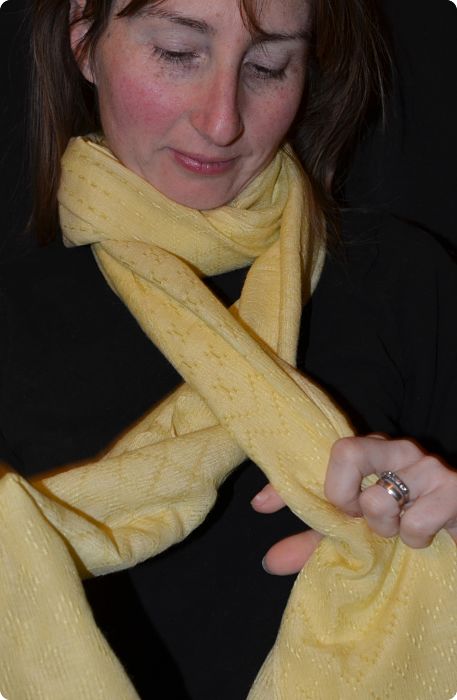 Empar is wearing a fine yellow shawl with fancy weave and beading