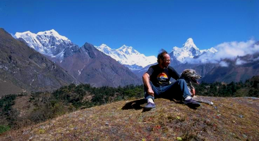 Seth with his wolfhound Namche at Syangboche, with Everest, Lhotse, Nuptse, and Ama Dablam in the background